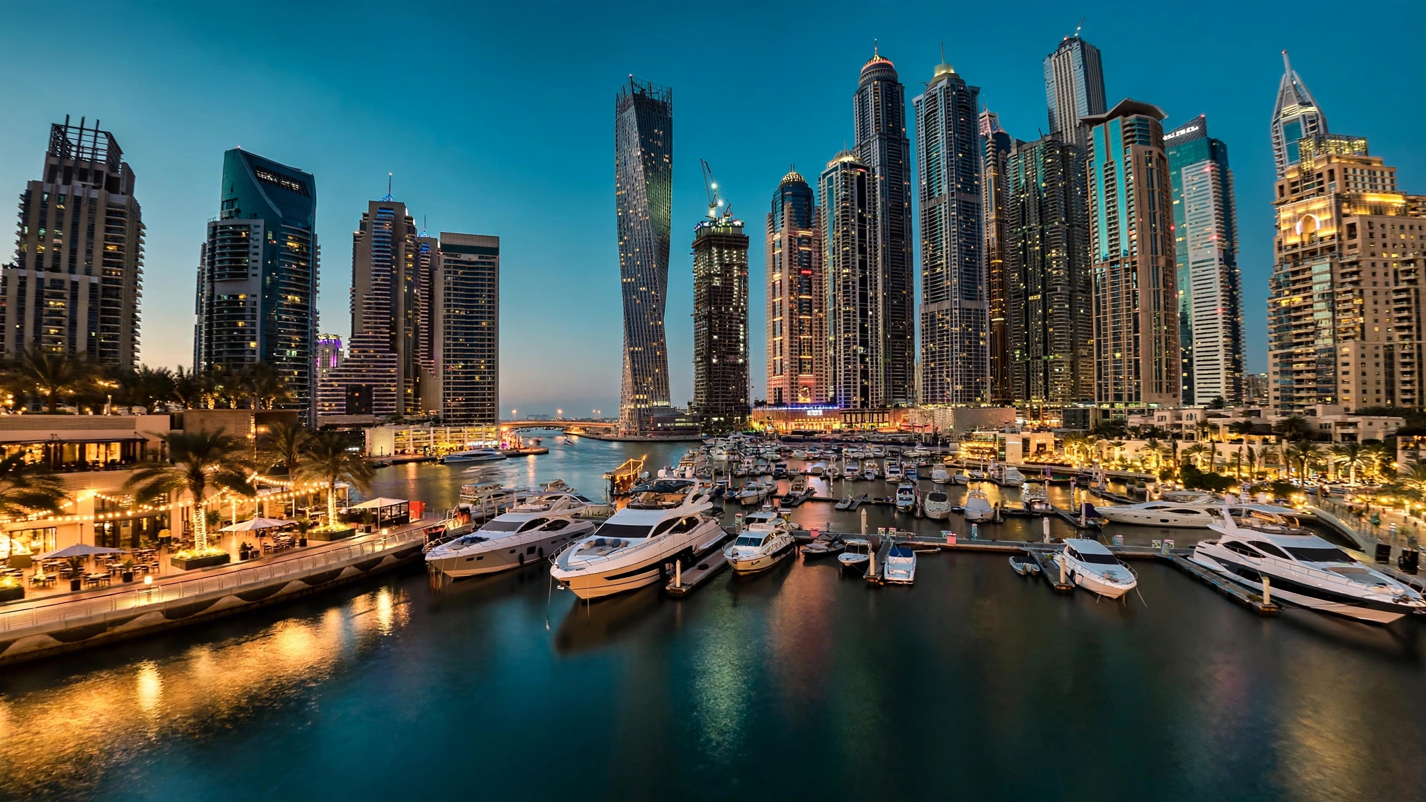 Dubai Marina at dusk with yachts